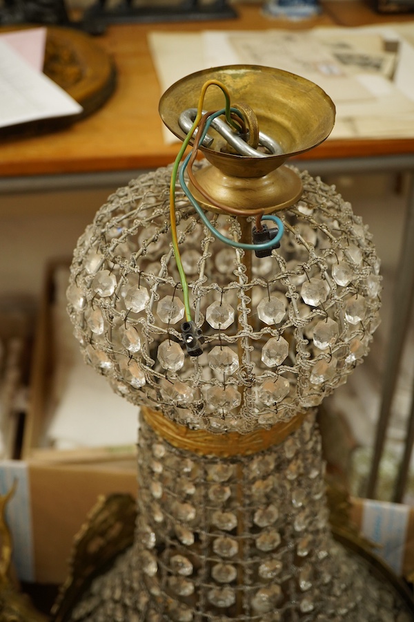 A large five light basket chandelier mounted with gilt metal stags heads, 90cm high